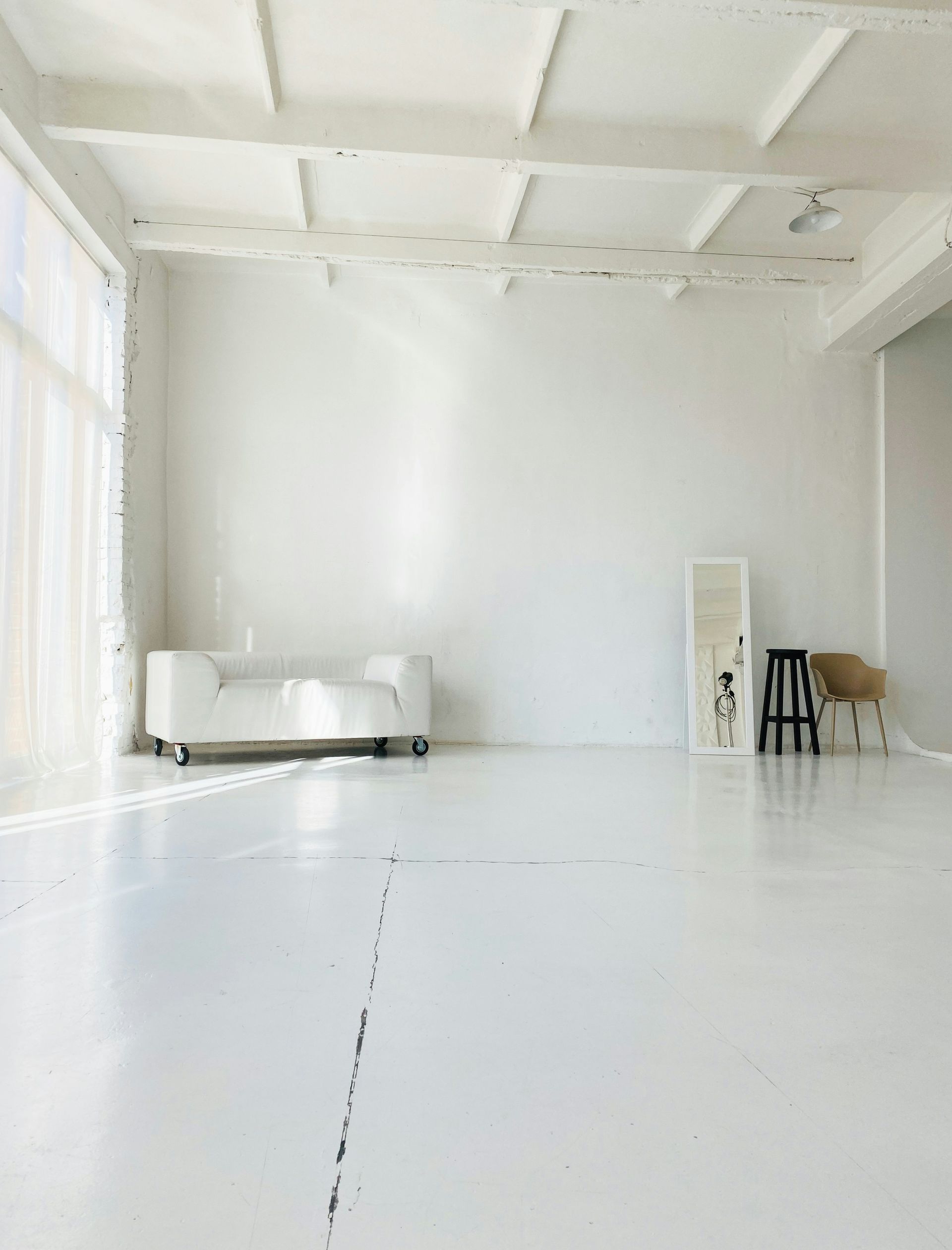 white bed near white wall